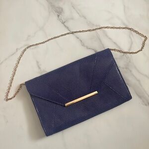 Blue faux snake skin clutch. With chain or without by keeping  it in the bag.